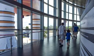 Kai and Kenny work their way along the gentle slope of the ramp which leads to the vestibule where you are given a presentation, just before entering the Great Room which encloses the Space Shuttle Atlantis.